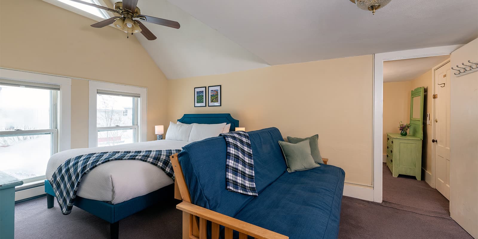 Queen bed and futon in Suite 4