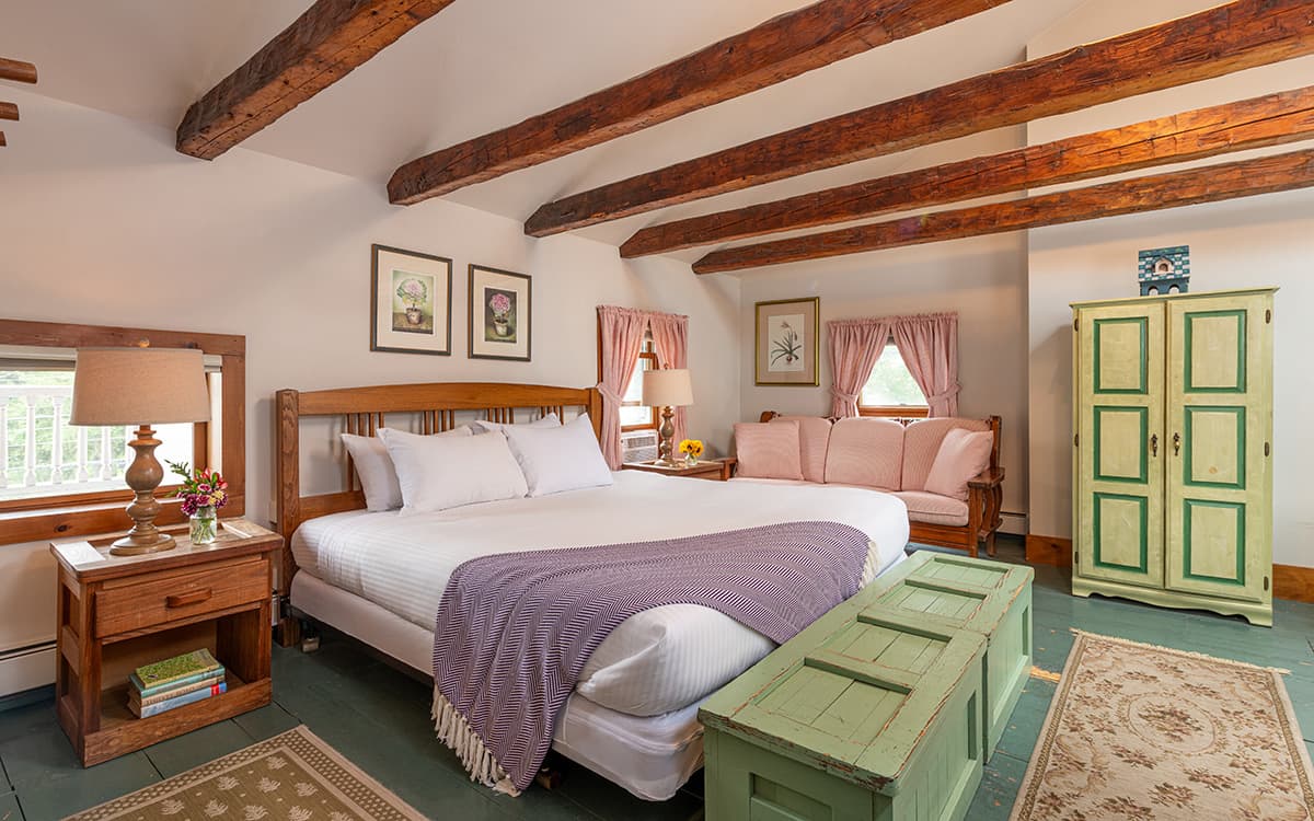 King Bed in Room 7 with wooden beams