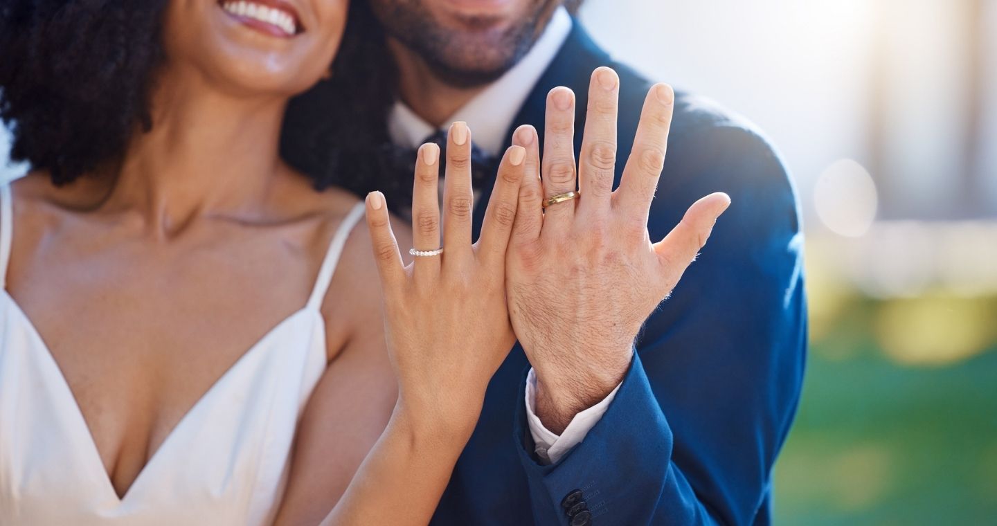 Recently married couple showing off rings after their elopement ceremony in VT
