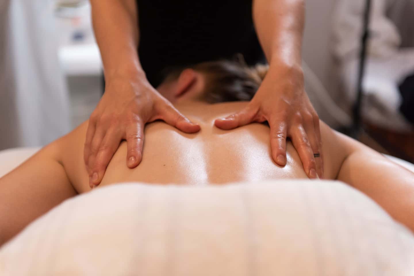 A woman getting a massage during her Vermont vacation