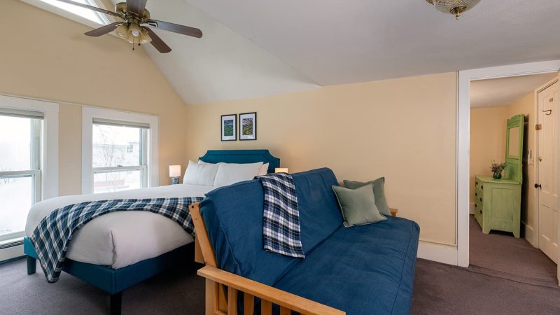 Queen bed and futon in Suite 4
