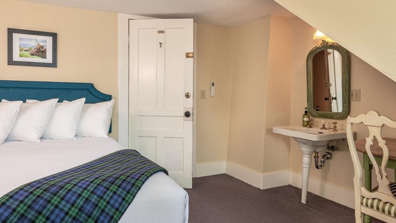 Queen Bed in Room 3 with chair
